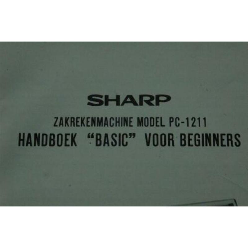 Sharp PC-1211 manual rekenmachine calculator