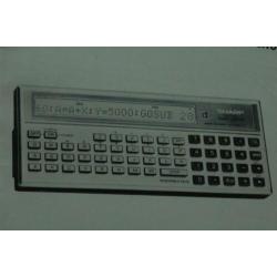 Sharp PC-1211 manual rekenmachine calculator