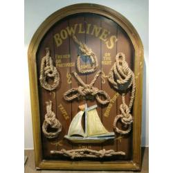 Houten wandbord met zeilboot en knopen