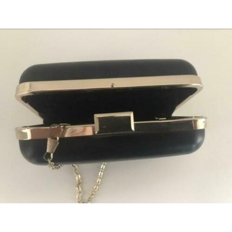 Black clutch bag with gold trim, 212 VIP by Carolina Herrera