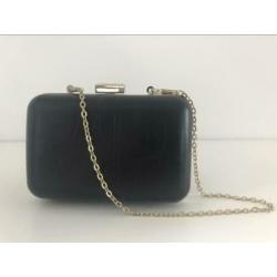 Black clutch bag with gold trim, 212 VIP by Carolina Herrera