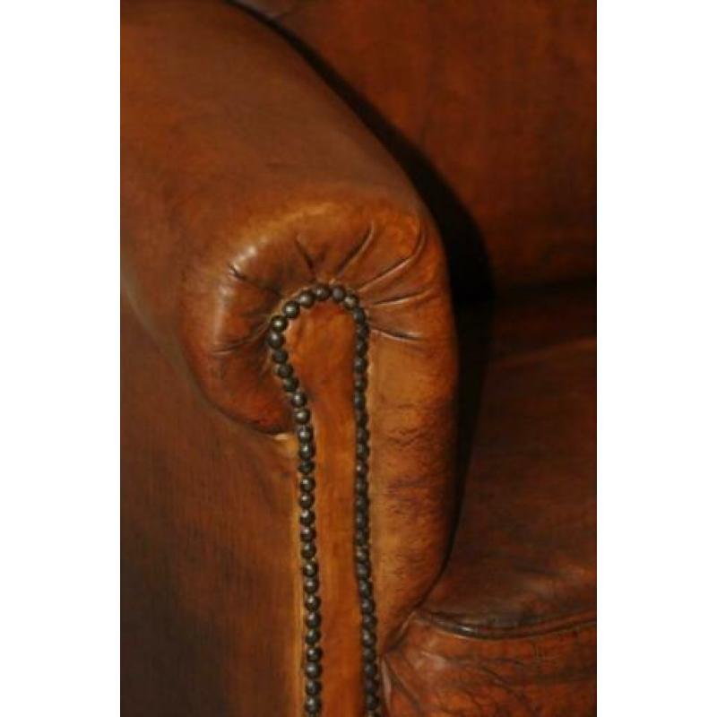 Antieke schapenleren fauteuil. i.z.g.s.