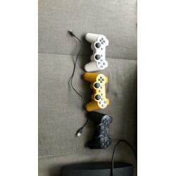 PS3 plus 3 controllers en spellen