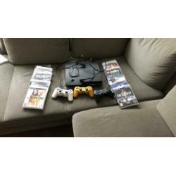 PS3 plus 3 controllers en spellen